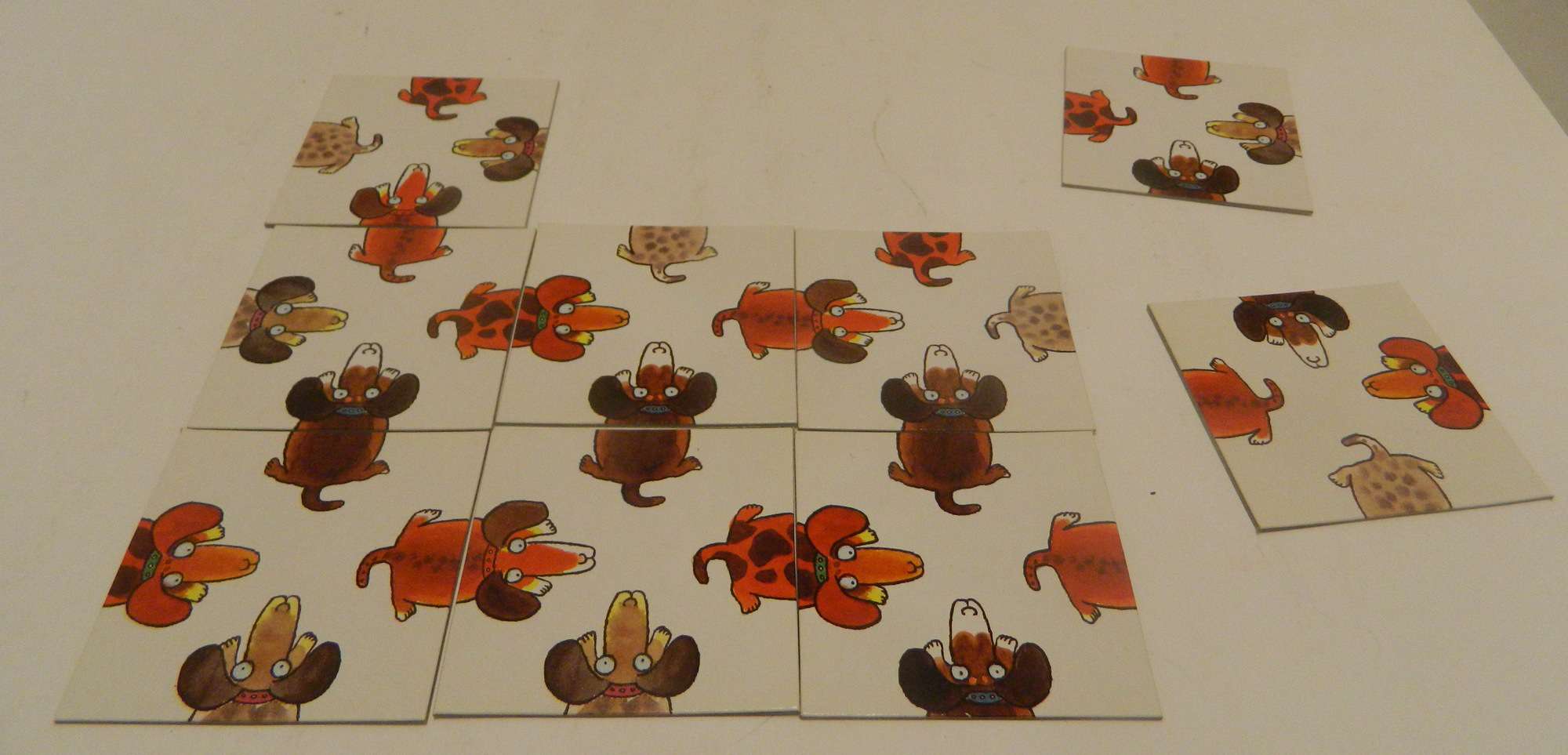 Vintage 1980, The Crazy Dog Collectible Puzzle Game by Price Stern Sloan.  Arrange the 9 cards in such a way that the heads and tails of each