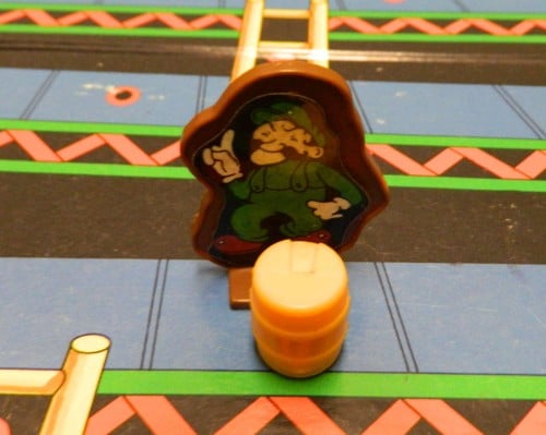 Colliding with barrel in Donkey Kong board game