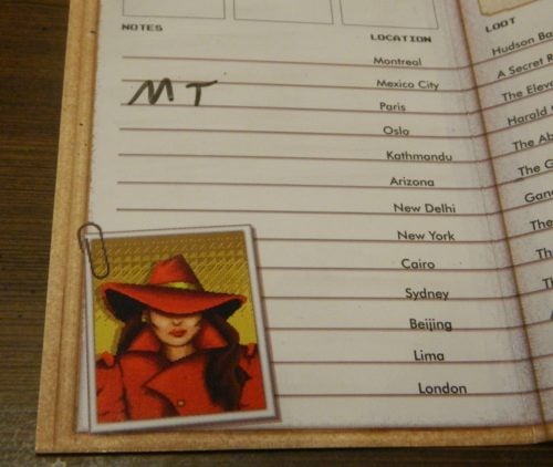 Taking Notes in Where In The World Is Carmen Sandiego? Card Game