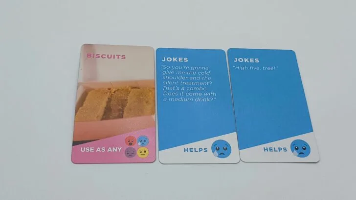 A player choose to play two blue and one Biscuit card from their hand.