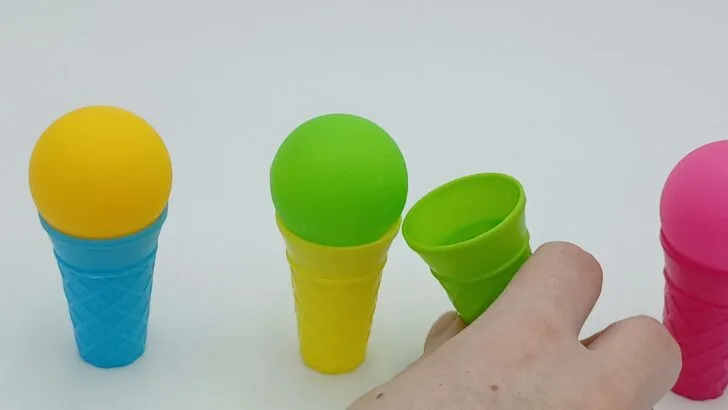 The player is now moving the green scoop of ice cream to the yellow cone.