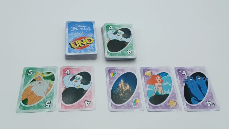 Playing a card in UNO Disney Princess Little Mermaid Ariel