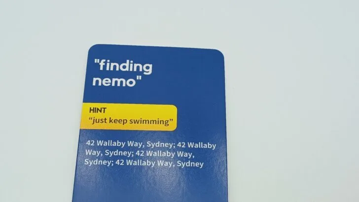 A close-up of the hint section on the back of a clue card. For the "Finding Nemo" card it is "just keep swimming."
