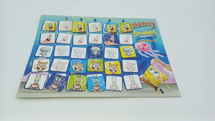 This picture shows the scoreboard at the end of the game. The yellow player scored five from Squidward, four from Sandy, and two from SpongeBob. The green player scored five from SpongeBob, three from Sandy, and two from Mr. Krabs. The blue player got four from SpongeBob, three from Mr. Krabs, and two from Sandy. Finally, the purple player scored four from Patrick, three from Squidward, and one from Mr. Krabs. Those totals add up to 11 for yellow, 10 for green, 9 for blue, and 8 for purple. The yellow player has the most points and wins the game.
