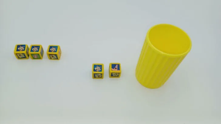 The player going for Sandy dice has completed their third and final roll. They got a fourth Sandy but their other roll (a Patrick) is not re-rollable.