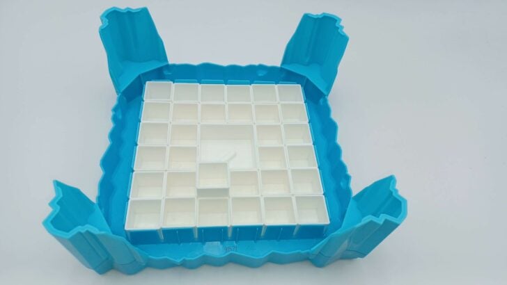 A picture of the assembly for Don't Break the Ice. The ice tray frame is upside down to make it easy to put the ice blocks and tray legs into the proper places.