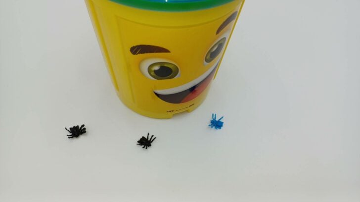 A picture of three flies escaping while the player threw away their trash (two black and one blue).