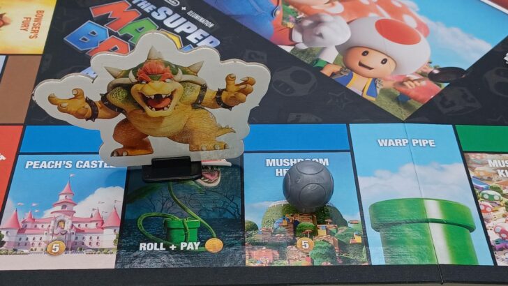 Bowser moves past a player in Monopoly The Super Mario Bros Movie