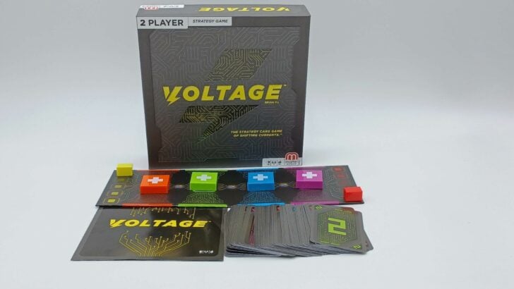 A picture of all of the components included in Voltage including a small board, four plastic terminal tokens, two score markers, the rules, and cards.