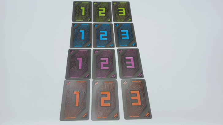 An image showing all of the different number cards in Voltage (green 1-3, then blue 1-3, purple 1-3, and finally orange 1-3).
