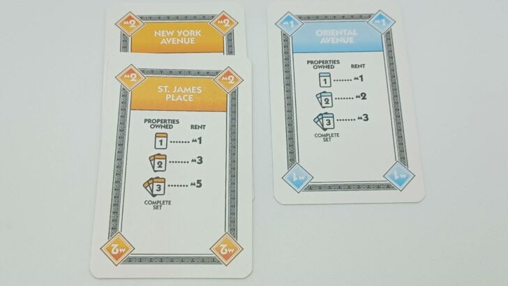 Three property cards played to a player's collection