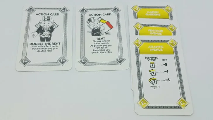 A player using the Double the Rent card to increase the amount of rent they can charge the other players.