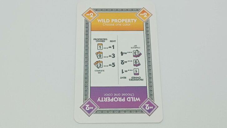 A Wild Property card featuring orange and purple.