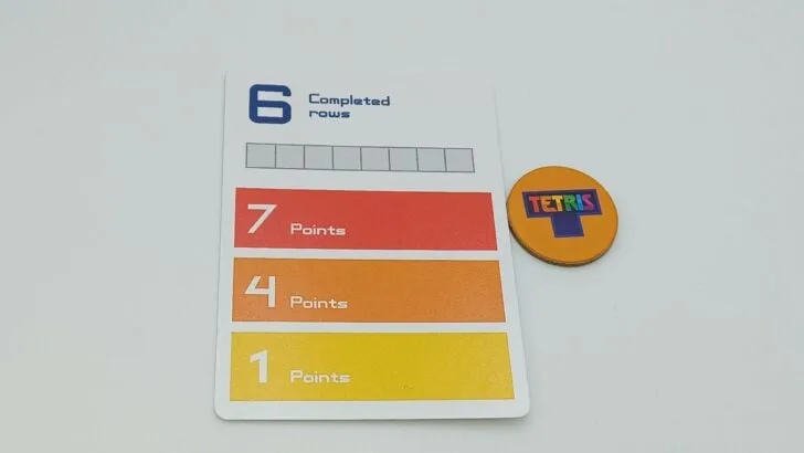 Completing an Achievement card in the 2021 Tetris Board Game