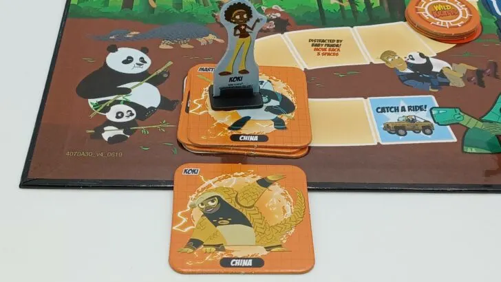 A player taking their Creature Power Suit token
