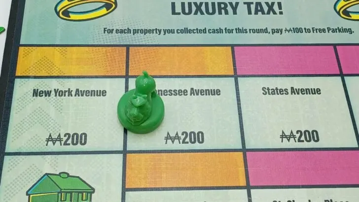 Collecting rent from a property in Monopoly Knockout
