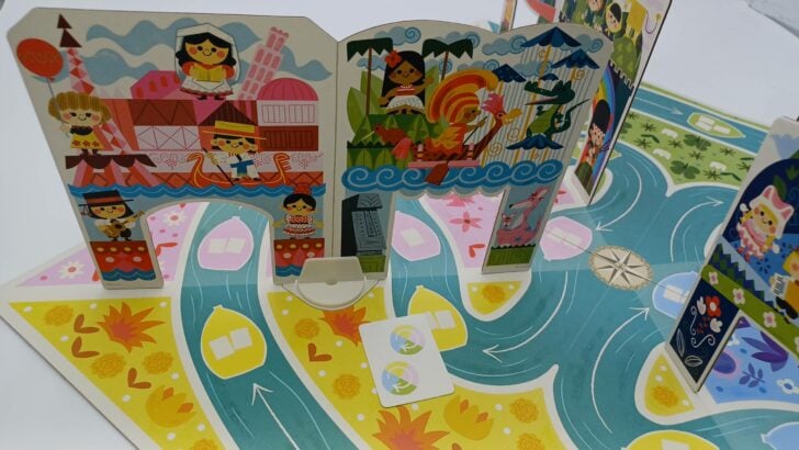 Using a Flip the Scenes card in It's A Small World