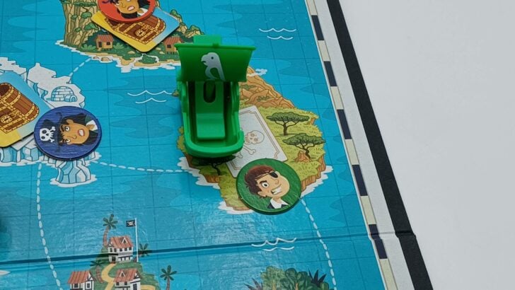 The green player lands on an island they already control